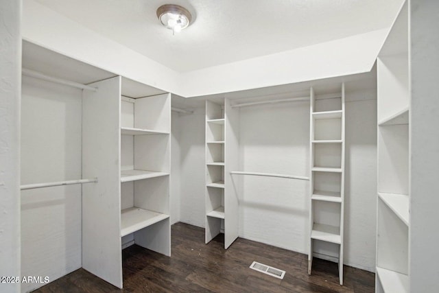 8343 W Calle Lejos, Peoria, AZ 85383 - spacious closet featuring dark wood-style floors