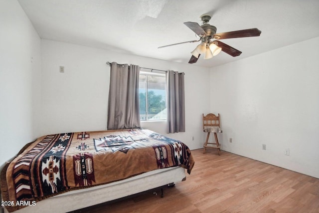 8343 W Calle Lejos, Peoria, AZ 85383 - bedroom with light wood-style floors and ceiling fan