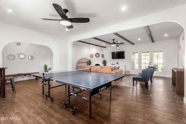 game room featuring ceiling fan, hardwood / wood-style flooring, french doors, and beamed ceiling