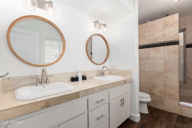 bathroom featuring hardwood / wood-style flooring, vanity, and toilet