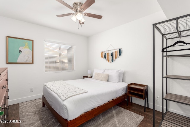 bedroom featuring dark wood-type flooring and ceiling fan