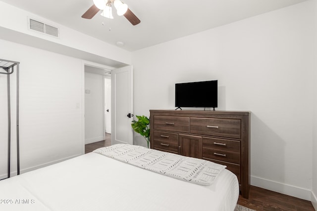 bedroom featuring dark wood-type flooring and ceiling fan