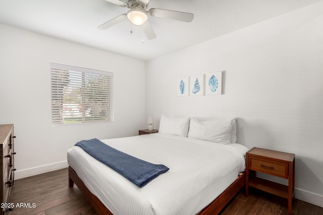 bedroom with dark wood-type flooring and ceiling fan