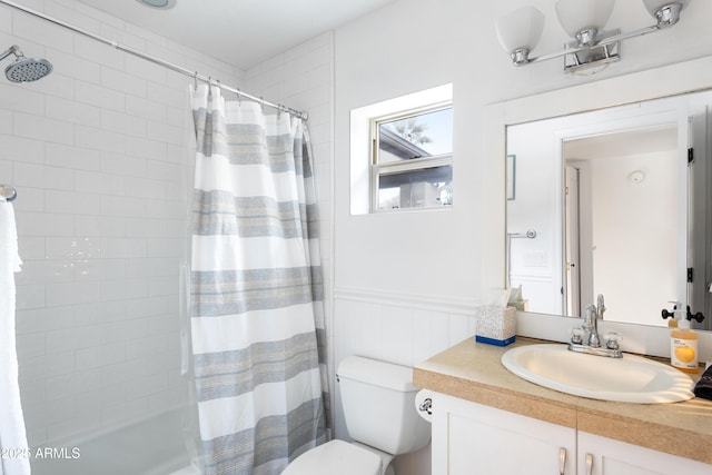 full bathroom featuring vanity, toilet, and shower / tub combo with curtain