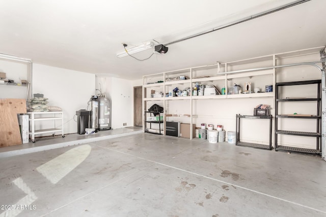 garage with a garage door opener and water heater