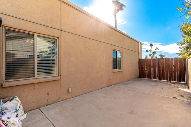 view of side of home featuring a patio area