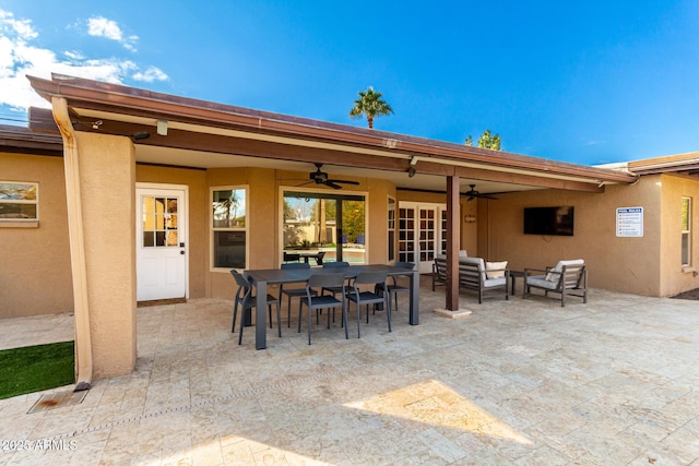 view of patio with french doors, ceiling fan, and an outdoor living space