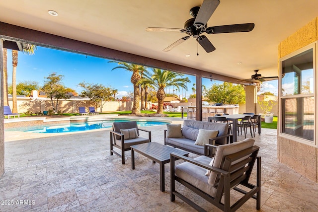 view of patio / terrace featuring a fenced in pool, an outdoor hangout area, and ceiling fan