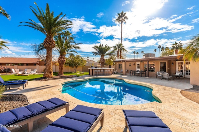 view of pool featuring a bar, a patio area, and outdoor lounge area