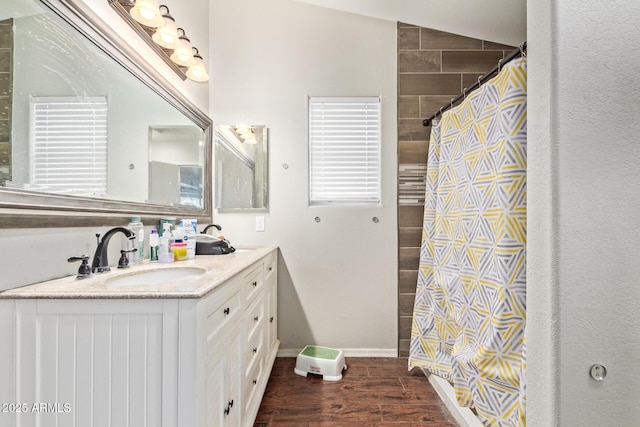 3821 N 125th Dr, Avondale, AZ 85392 - bathroom with vanity, curtained shower, and wood finished floors