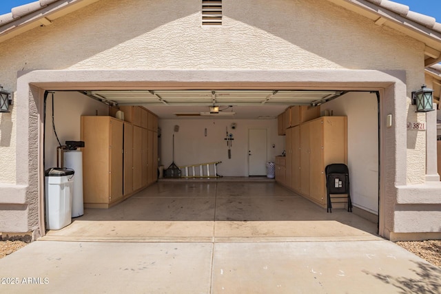 3821 N 125th Dr, Avondale, AZ 85392 - garage with driveway and a garage door opener