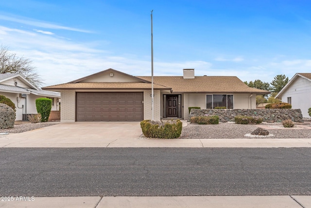 ranch-style home featuring a garage