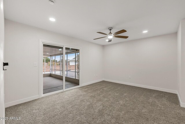 carpeted empty room featuring baseboards, recessed lighting, and a ceiling fan