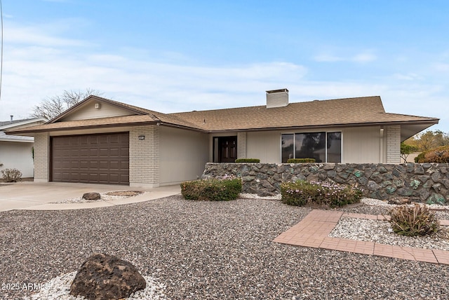 ranch-style house featuring a garage