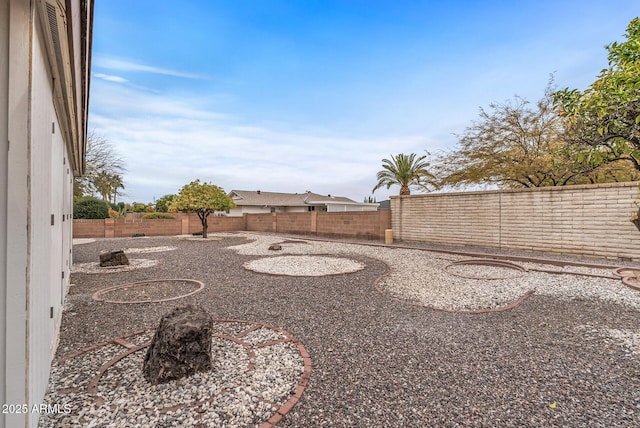 view of yard with a fenced backyard
