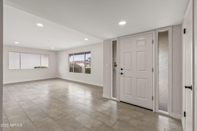 entryway featuring baseboards and recessed lighting