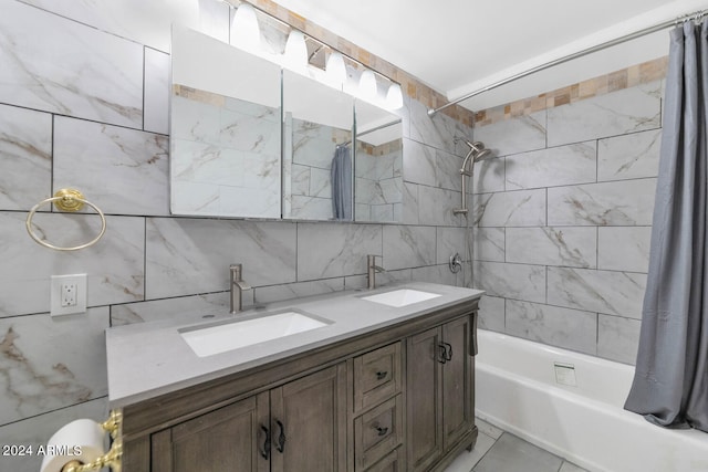 bathroom with vanity, shower / bathtub combination with curtain, tile walls, and tasteful backsplash