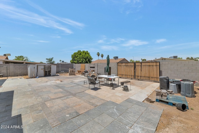 view of patio / terrace with a storage shed