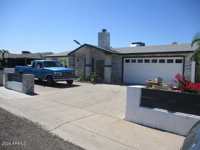 ranch-style house featuring a garage