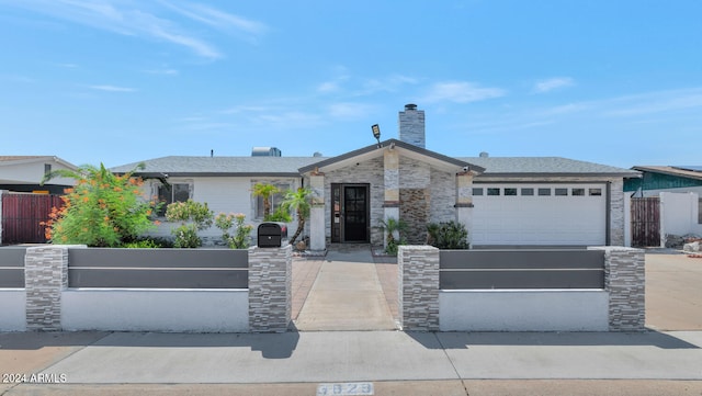 single story home featuring a garage