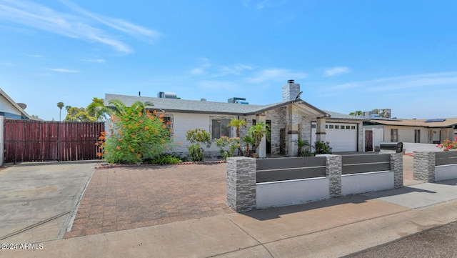 single story home with a garage