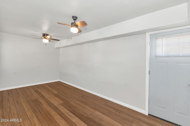 unfurnished room with hardwood / wood-style flooring and ceiling fan