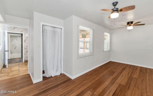 interior space with hardwood / wood-style flooring and ceiling fan