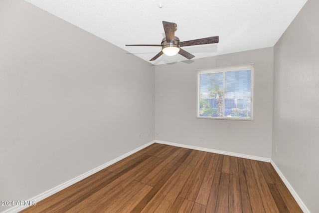 unfurnished room featuring ceiling fan and hardwood / wood-style flooring