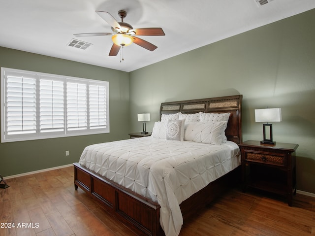 bedroom with hardwood / wood-style floors and ceiling fan