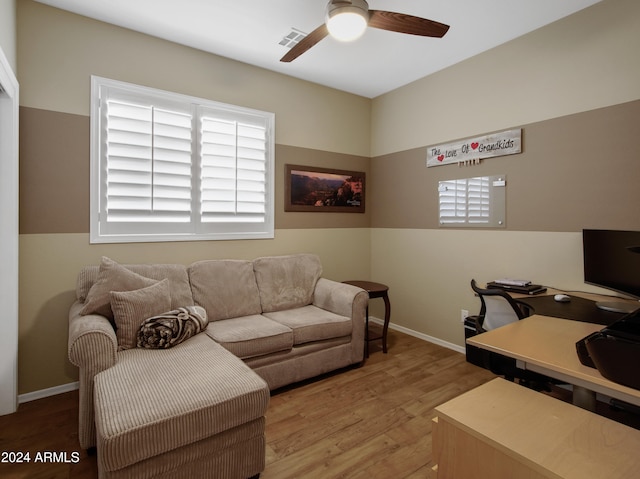 home office with hardwood / wood-style flooring, a wealth of natural light, and ceiling fan