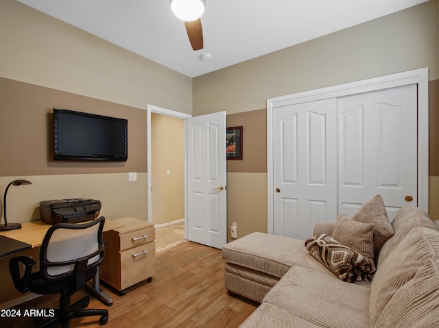 office space featuring ceiling fan and light hardwood / wood-style floors