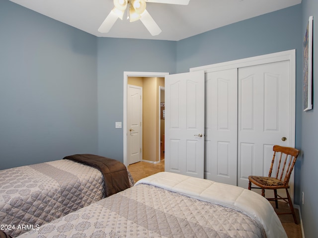 bedroom with ceiling fan and a closet