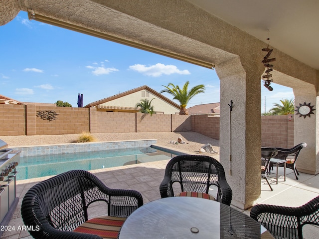 view of swimming pool featuring a patio