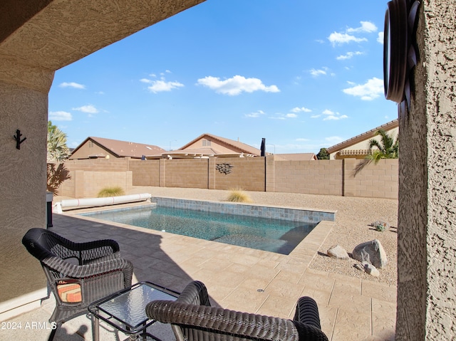 view of swimming pool featuring a patio area