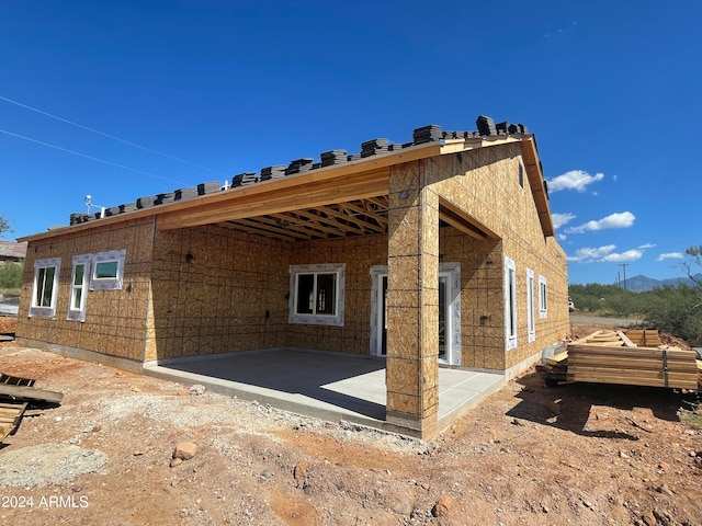 view of side of home featuring a patio