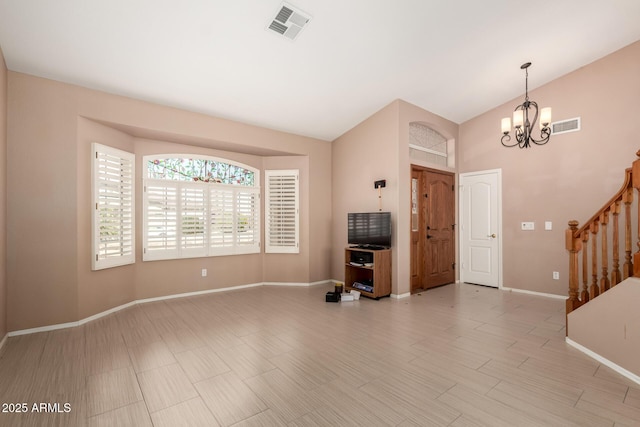 unfurnished living room featuring baseboards, a notable chandelier, stairs, and visible vents