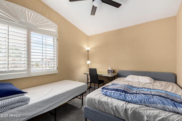 bedroom featuring ceiling fan, lofted ceiling, and carpet