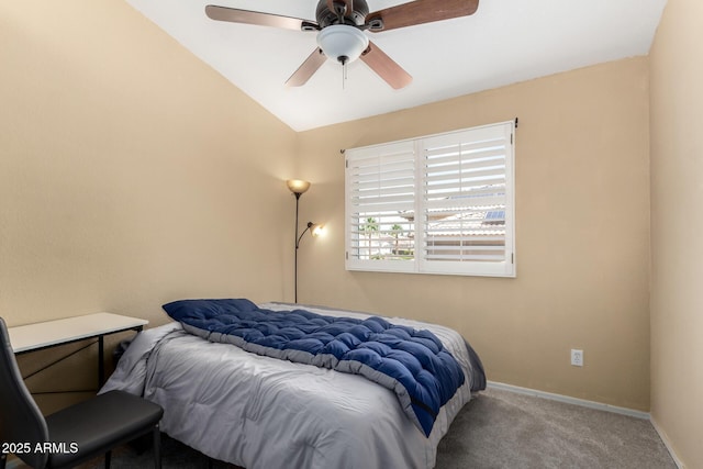 bedroom featuring carpet floors, a ceiling fan, baseboards, and vaulted ceiling