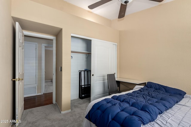 bedroom featuring carpet floors, ceiling fan, and a closet