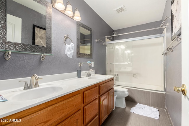 full bathroom featuring visible vents, a sink, shower / bathtub combination, and toilet