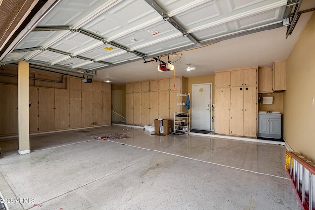 garage featuring a garage door opener and washing machine and clothes dryer