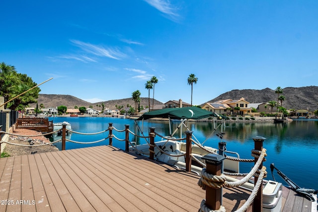 dock area featuring a water and mountain view