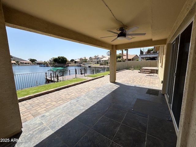 20713 N 56th Ave, Glendale, AZ 85308 - view of patio / terrace featuring a water view, a ceiling fan, a residential view, and a fenced backyard