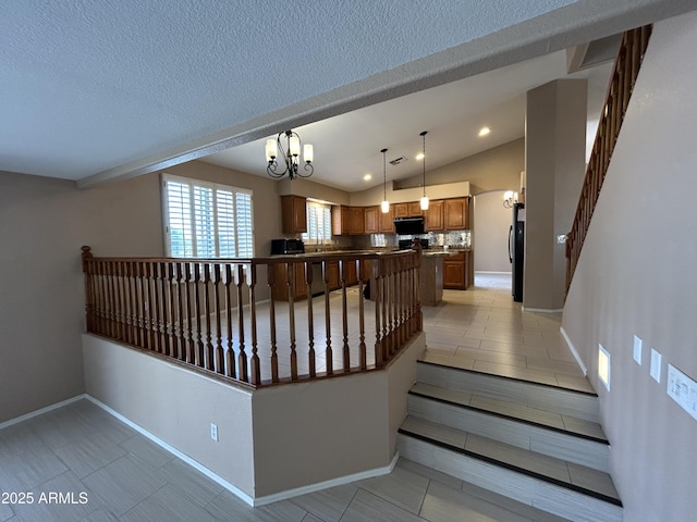 20713 N 56th Ave, Glendale, AZ 85308 - staircase with a chandelier, lofted ceiling, baseboards, and tile patterned flooring