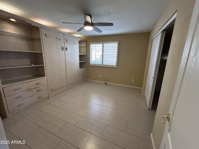 20713 N 56th Ave, Glendale, AZ 85308 - unfurnished bedroom with baseboards, a ceiling fan, and a closet