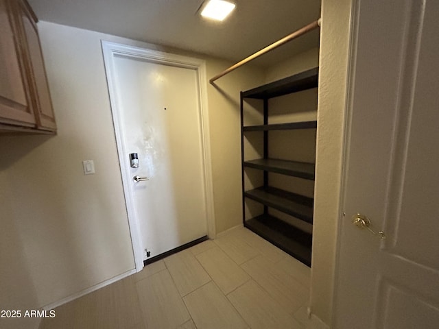 20713 N 56th Ave, Glendale, AZ 85308 - clothes washing area with cabinet space and baseboards