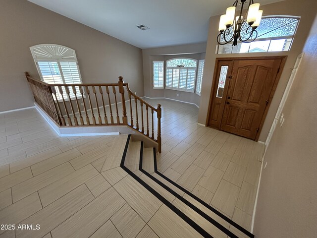 20713 N 56th Ave, Glendale, AZ 85308 - entrance foyer featuring a chandelier and baseboards