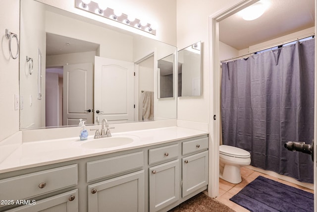 bathroom featuring tile patterned floors, vanity, toilet, and a shower with shower curtain