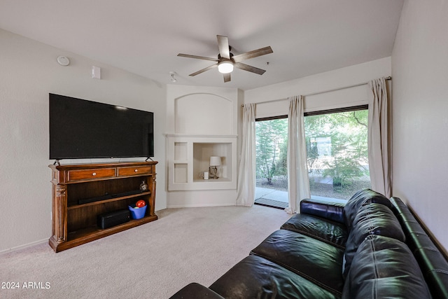 living room featuring ceiling fan and light colored carpet