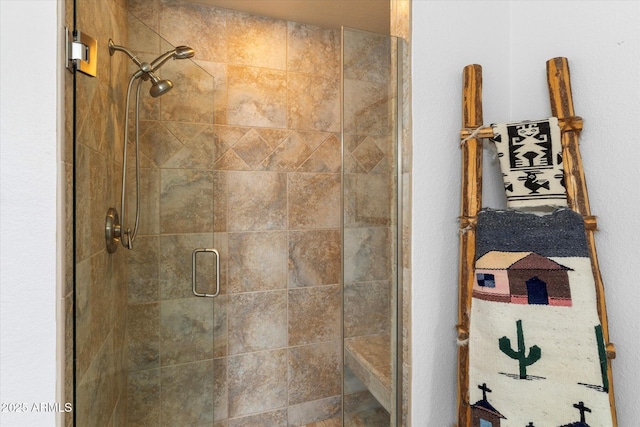 bathroom with a shower stall